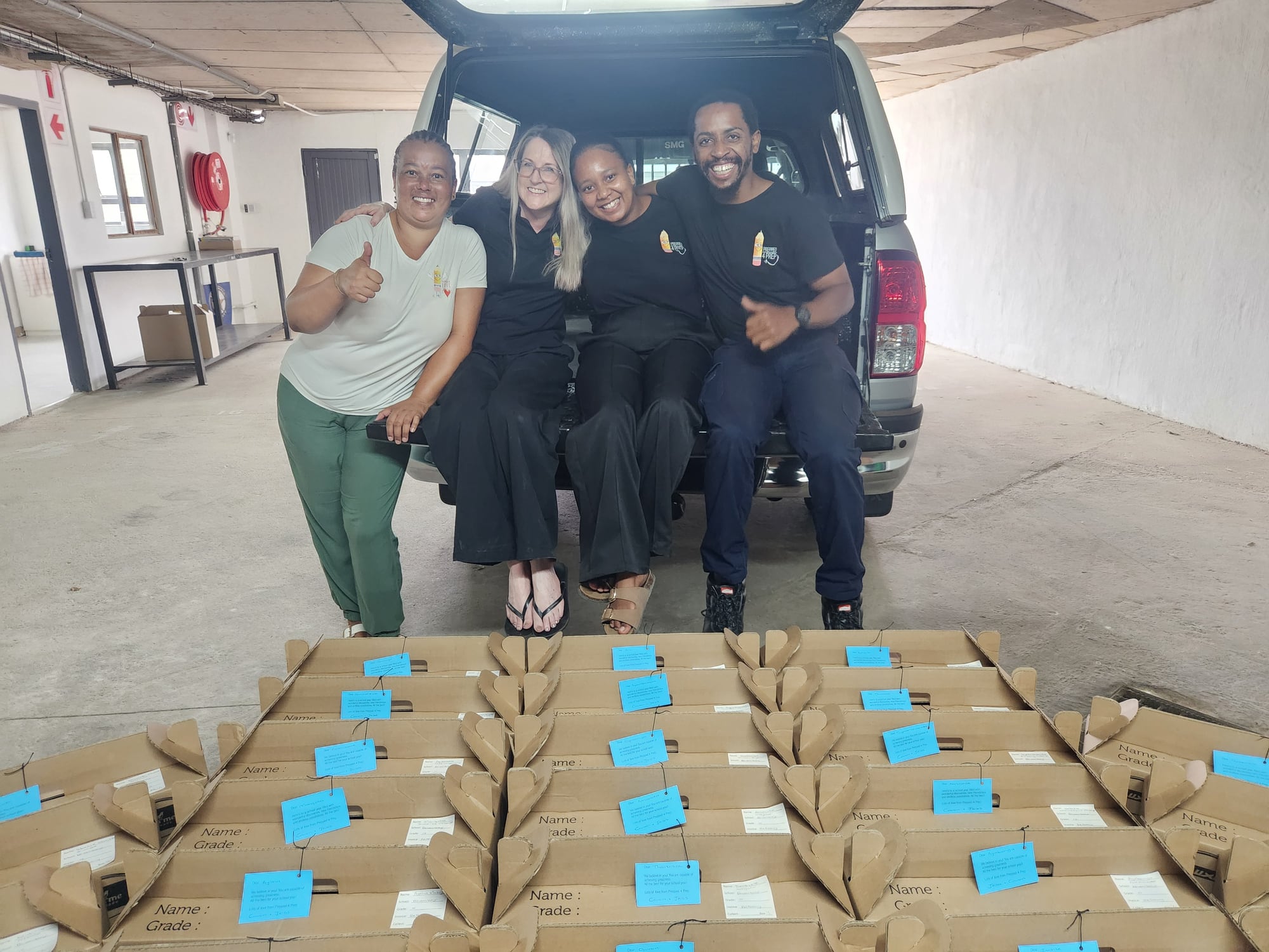 The Prepped 4 Prep team with completed stationery orders at the warehouse